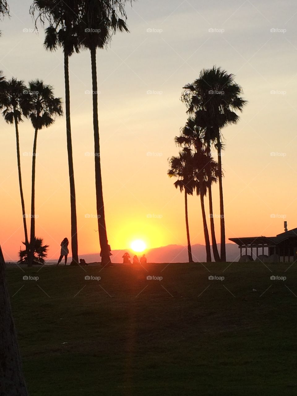 A beautiful Venice Beach scene as the sun kisses the Santa Monica Mts....I call it, “Sun as the day is done.”