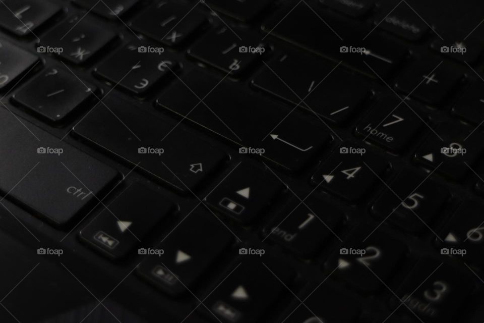 Dark keyboard texture close up