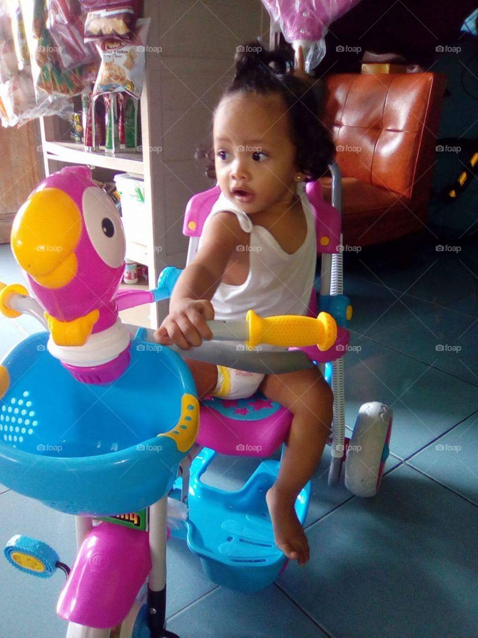 Our daughter Mary receiving her first tricycle in Philippines on her 1st birthday.
