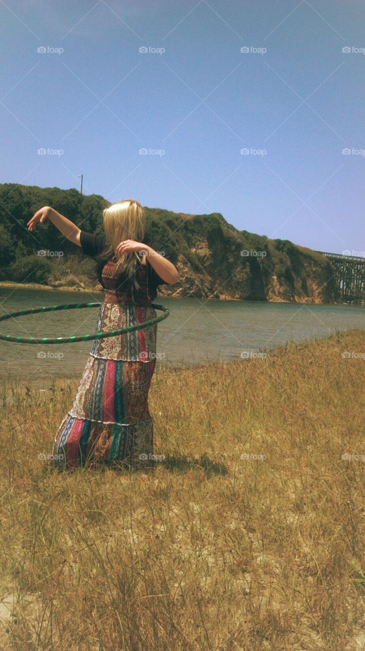 Hula hooping at the beach 