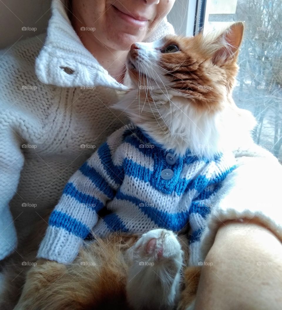 selfie girl with cat pet in the sweater