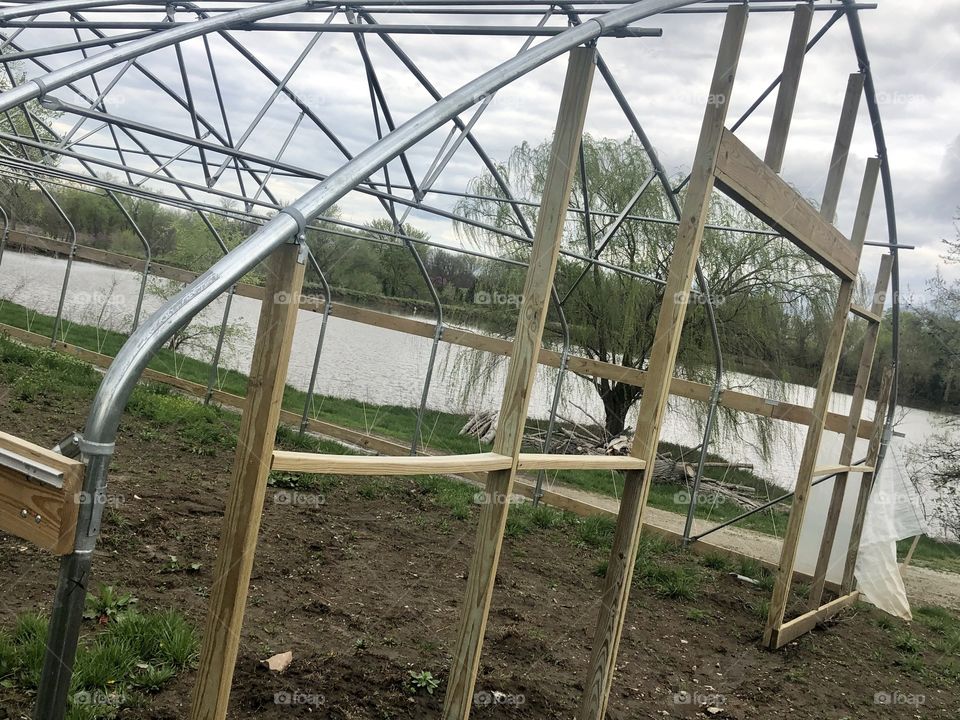 High Tunnel, Green House, Hoop House, Construction, building, build, unfinished, in progress, project, steel, wood, Farm, earth, soil, garden, gardening, dirt, sky, clouds, plastic, lake, water, pond, willow, tree