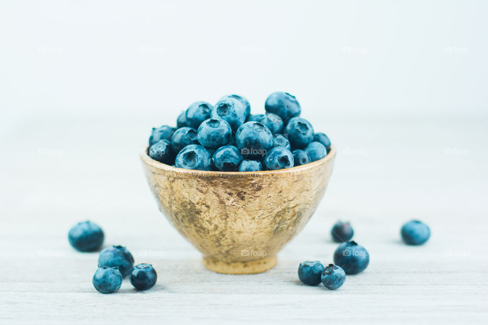 Gold Bowl Full of Fresh Blueberries 