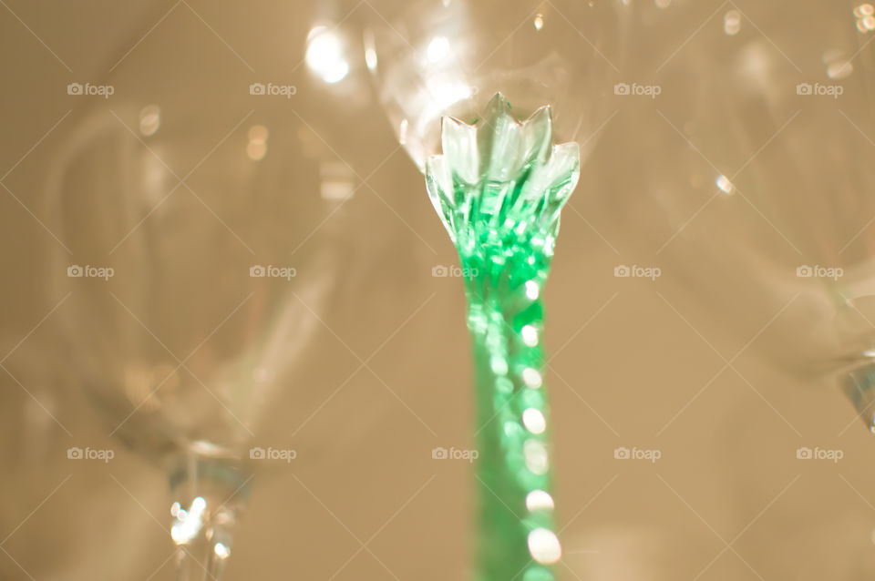 Vintage crystal stemware wine and champagne glasses with elegant twisted green stem low angle view 