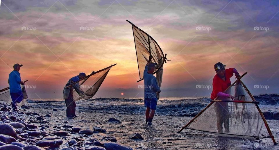 Fishermen in the dying sun