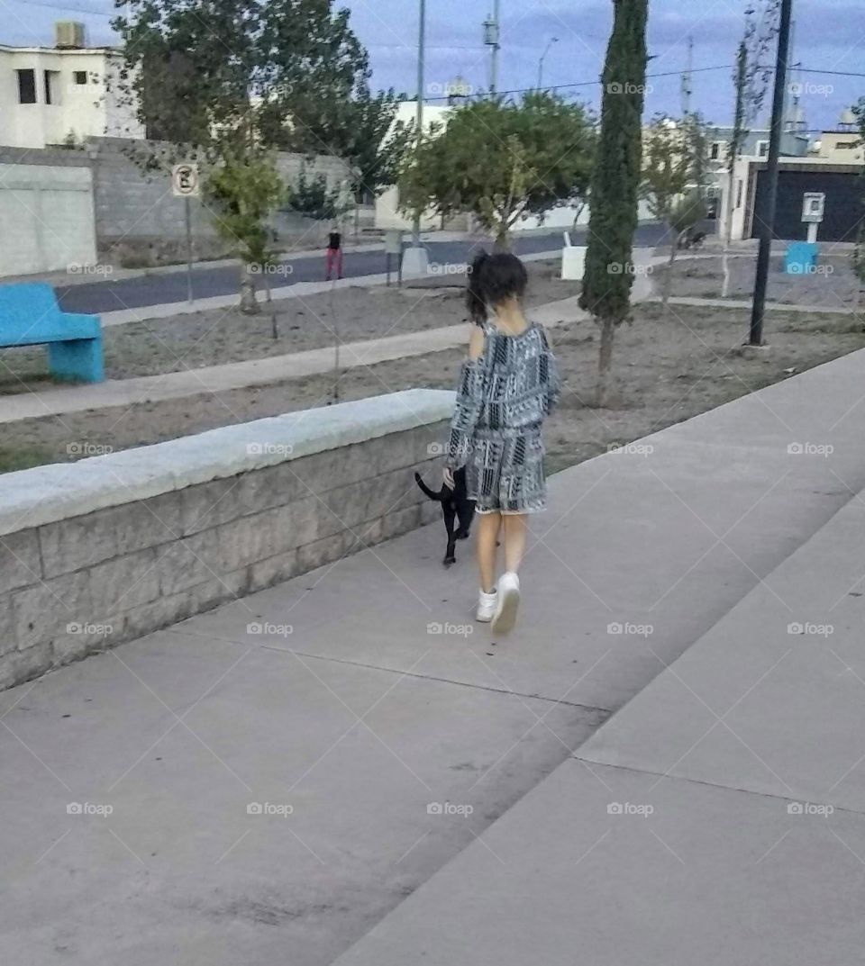 Walking in the street with my dog