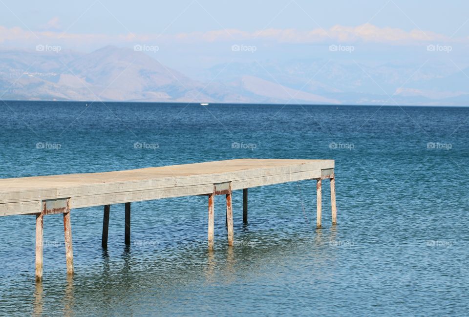 A pier over blue sea