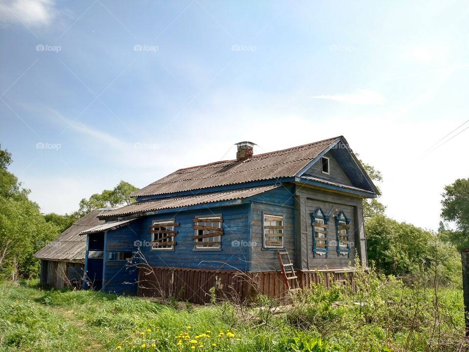 abandoned country house. wooden old house in the middle of russian country side