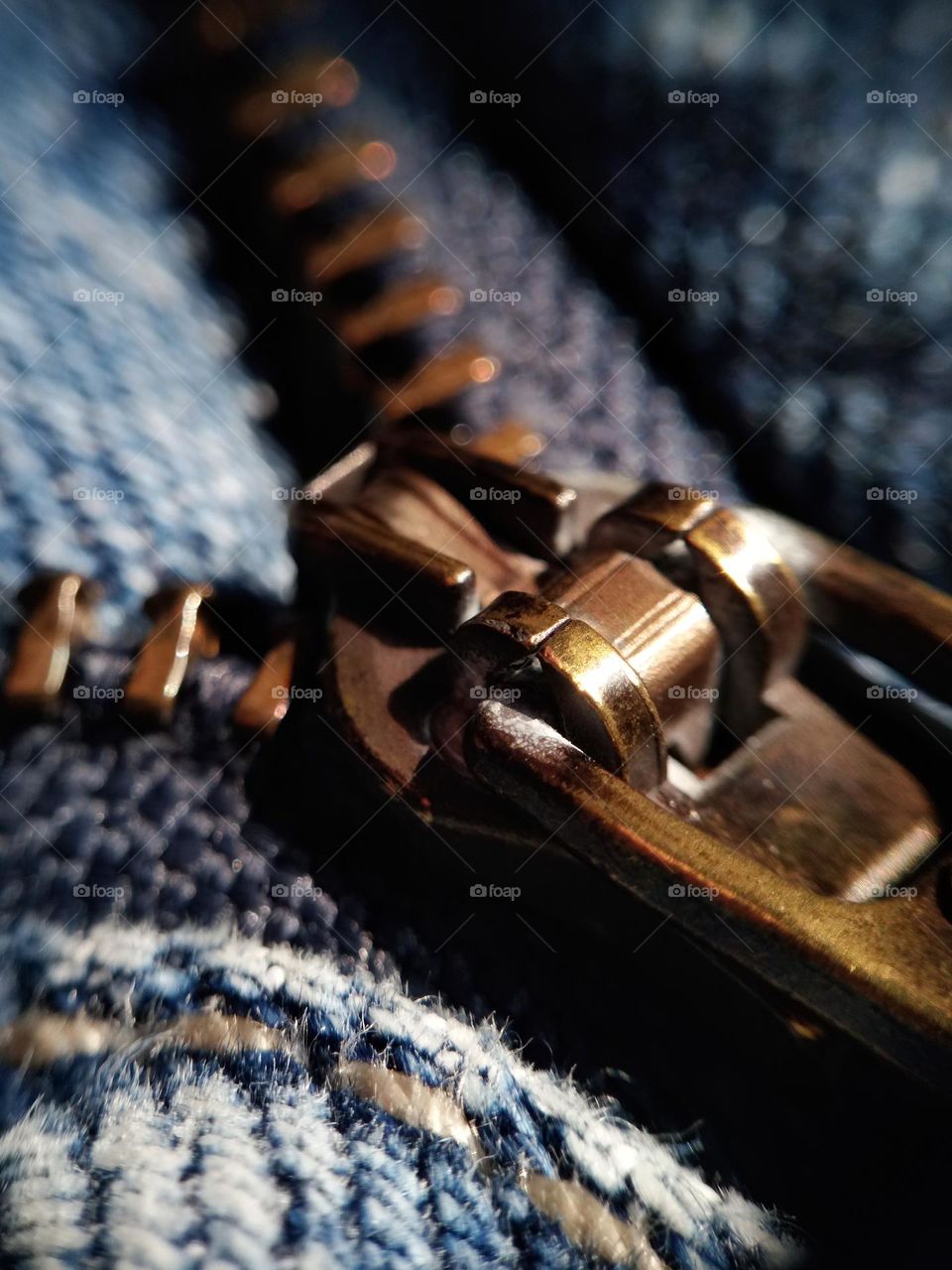 zipper of denim,  closeup