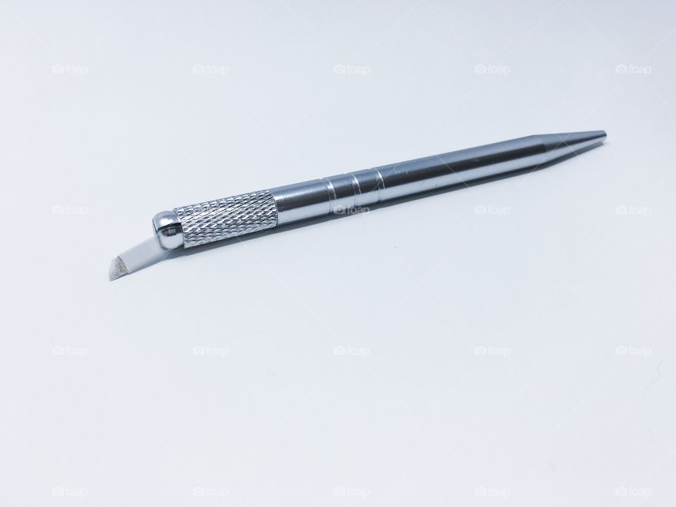 Microblading pen used for applying permanent eyebrow tattoo makeup 