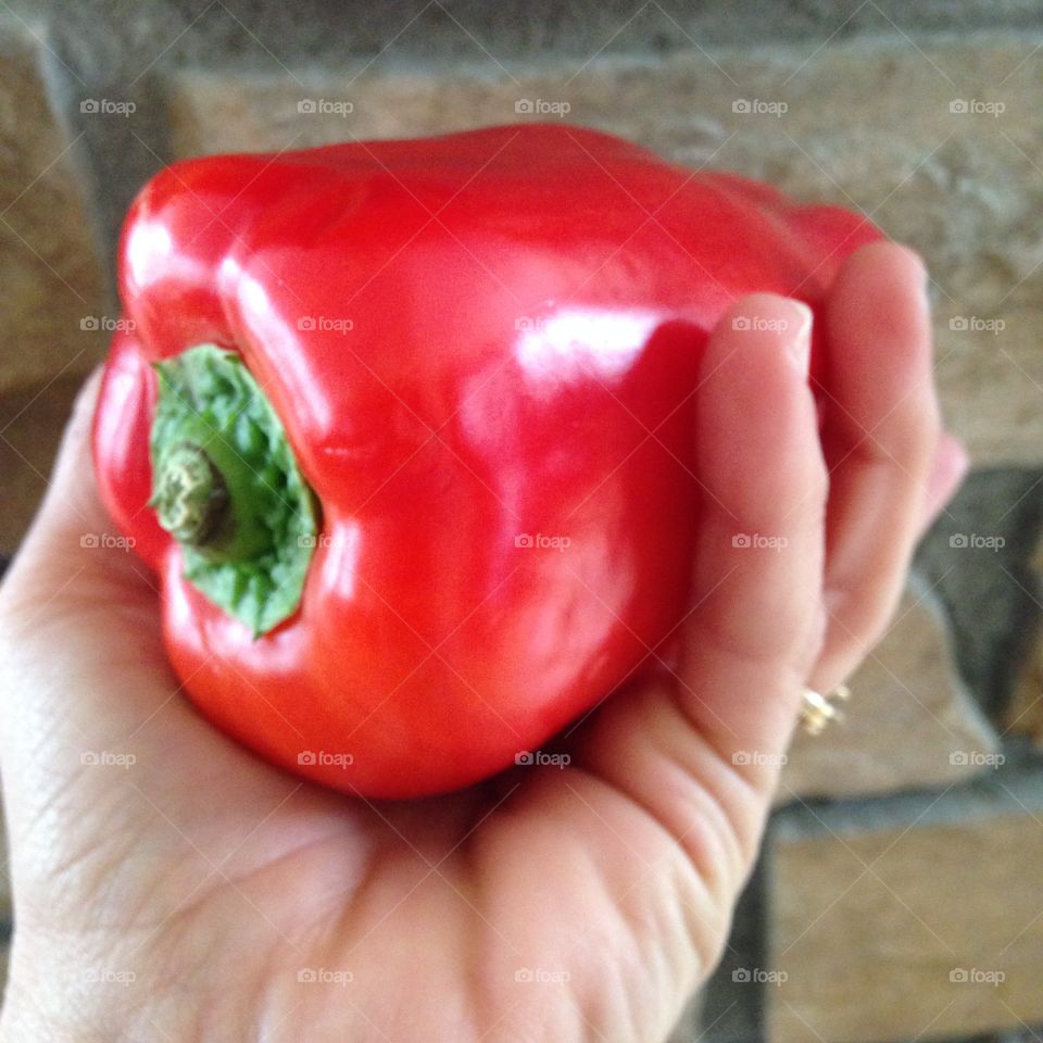 Holding red pepper 
