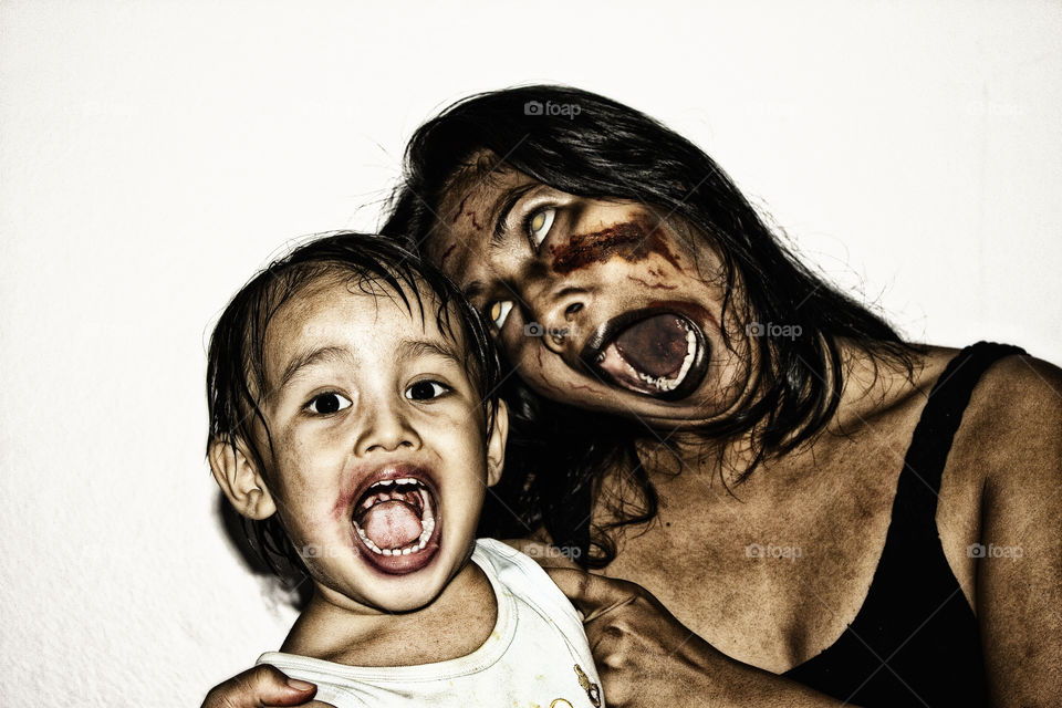 scary  mother and son zombies . make up for Halloween 