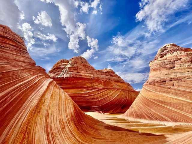 The Wave in northern Arizona is a highly sought-after permit hike that requires luck as well as miles of wandering through otherworldly desert landscapes. 