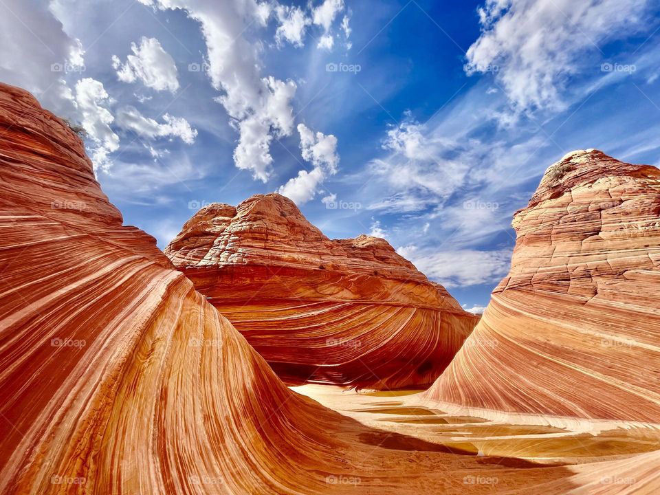 The Wave in northern Arizona is a highly sought-after permit hike that requires luck as well as miles of wandering through otherworldly desert landscapes. 