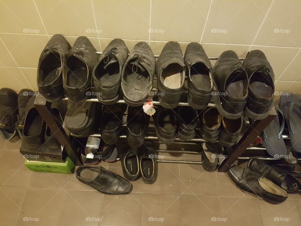 used shoes lined up on a rack