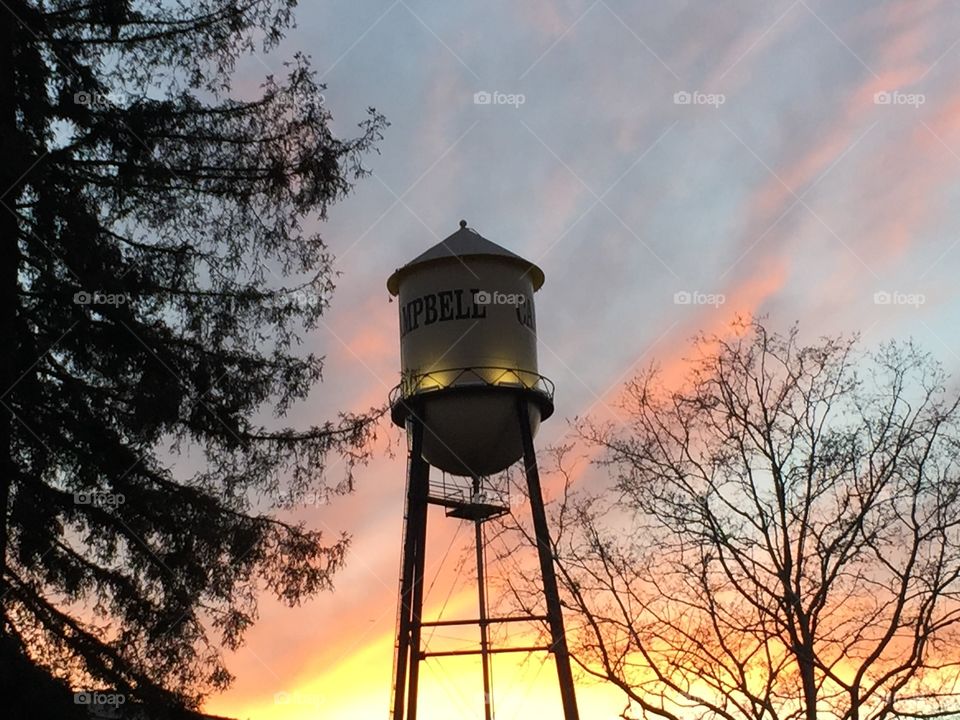Water tower during a glorious golden sunset 