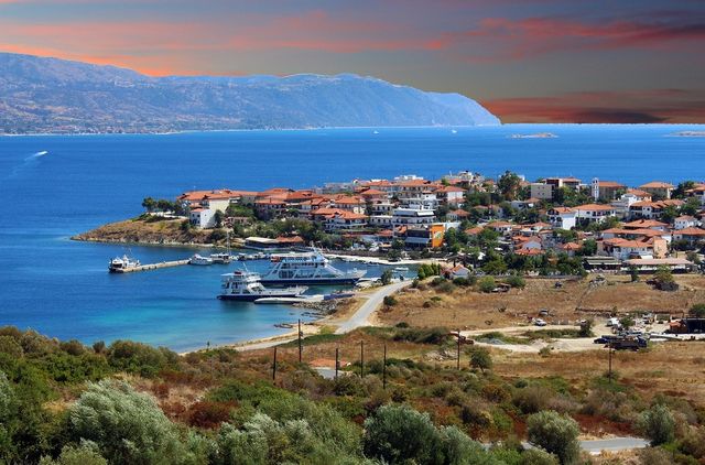 greece red clouds boat or ferry stagira-akanthos by jnen