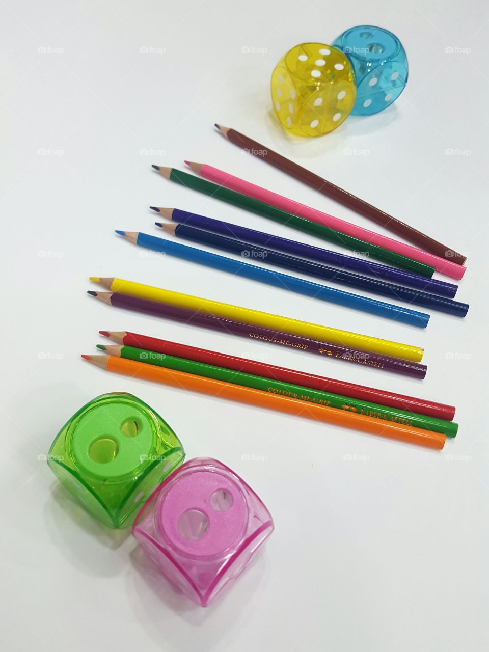 Multi colored coloring pencils plus dice themed plastic pencil sharpners