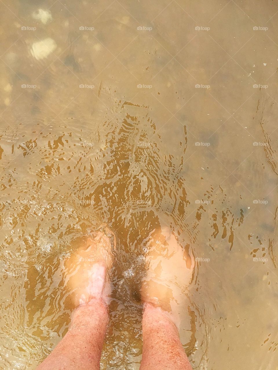 Feet in the sea