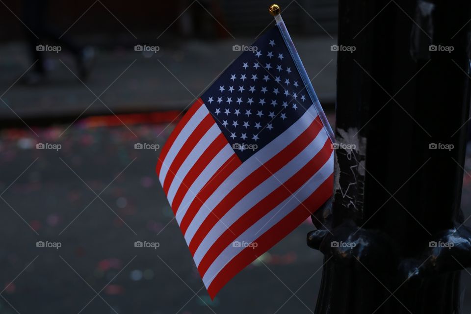 Flag hanging on post in New York City 