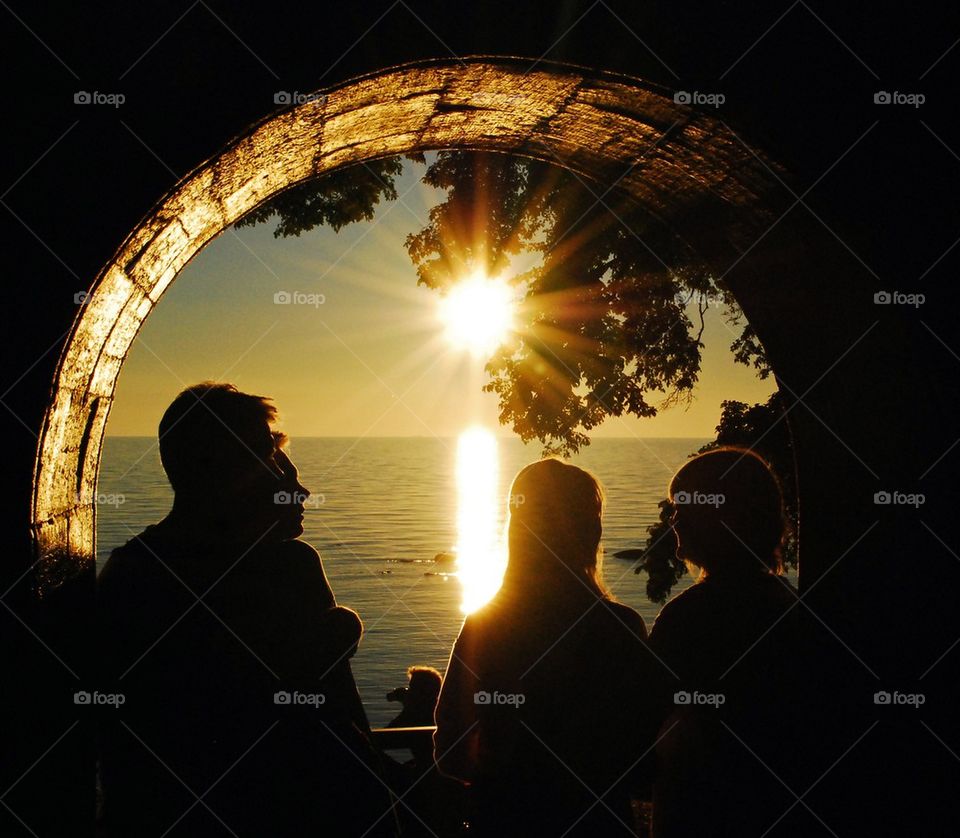 Sunlight on arch with people