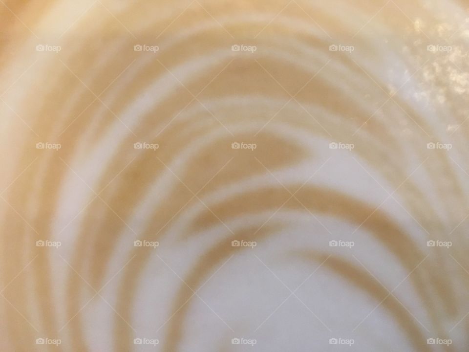 The top of my cappuccino before sprinkling chocolate on, at the Mug and Bean cafe, Mimosa Mall, Bloemfontein. In Spring.