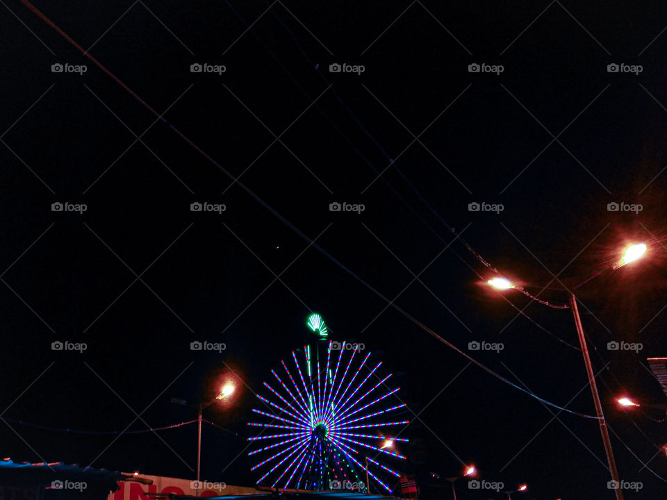 Amazing night light view of giant wheel from a far distance...