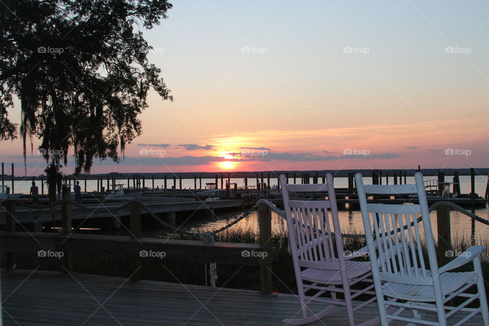 Rocking chairs at sunset