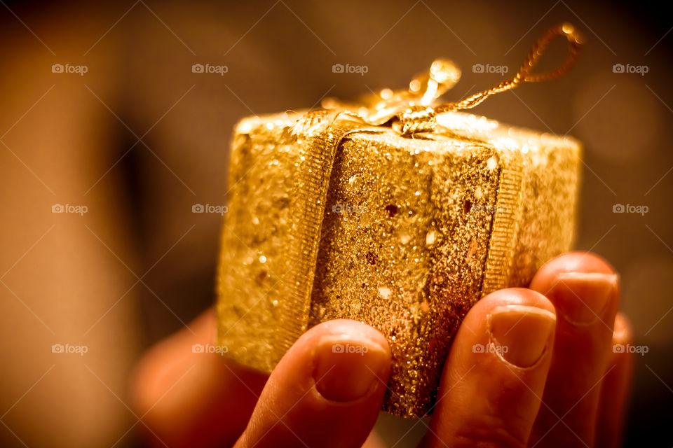 Man Giving Golden Gift
