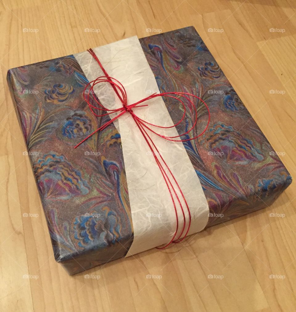 Present gift box. My first attempt at origami gift wrapping. No tape needed. 