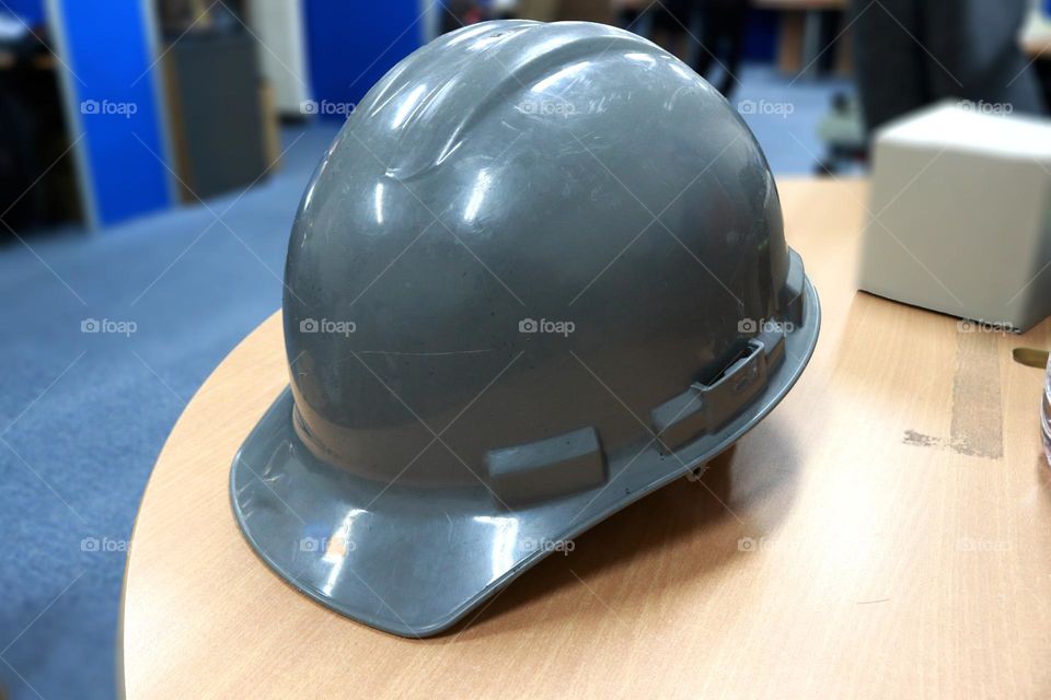 Grey safety helmet for workets to protect their head