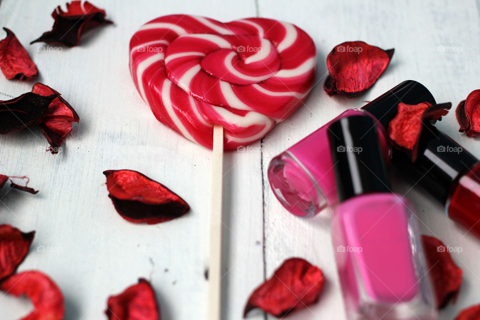 Beauty, health, spa and personal care: nail polish, flowers, rose petals, sweet