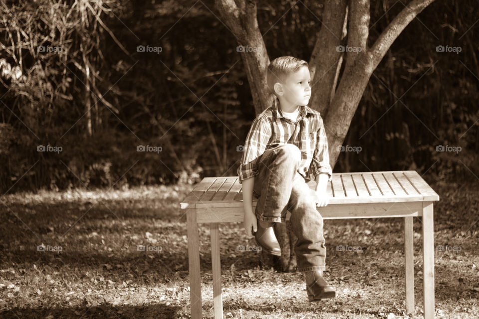 Boy on Bench at Park