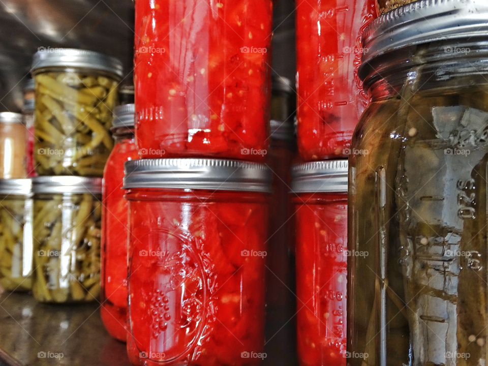 Canned Fruit And Vegetables. Homemade Canned Fruits And Vegetables In A Prepper's Stockpile
