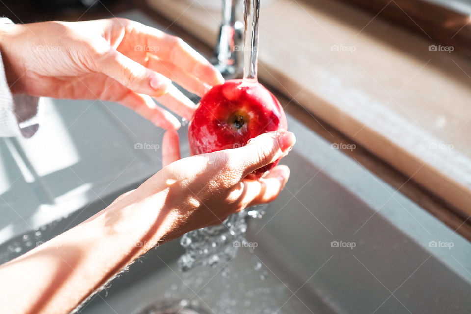 Red apple in the hands