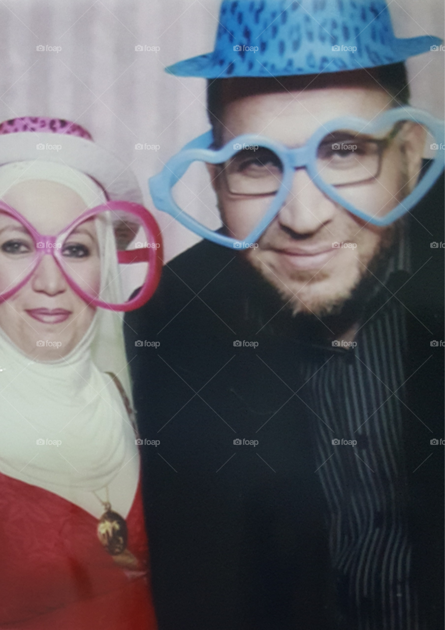 Funny glasses and hats in a wedding party