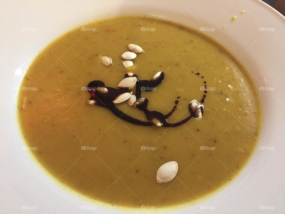 Pumpkin soup with a triple of pumpkin, pumpkin seeds and pumpkin oil.