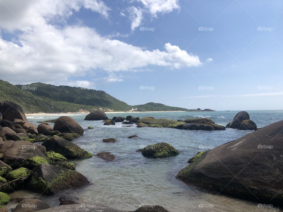 Rocks over the ocean in a Brazilian beach