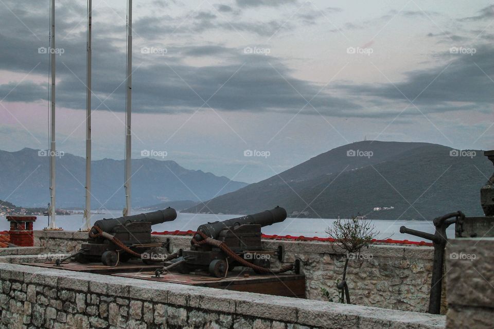 Close-up of cannon pointing towards sea