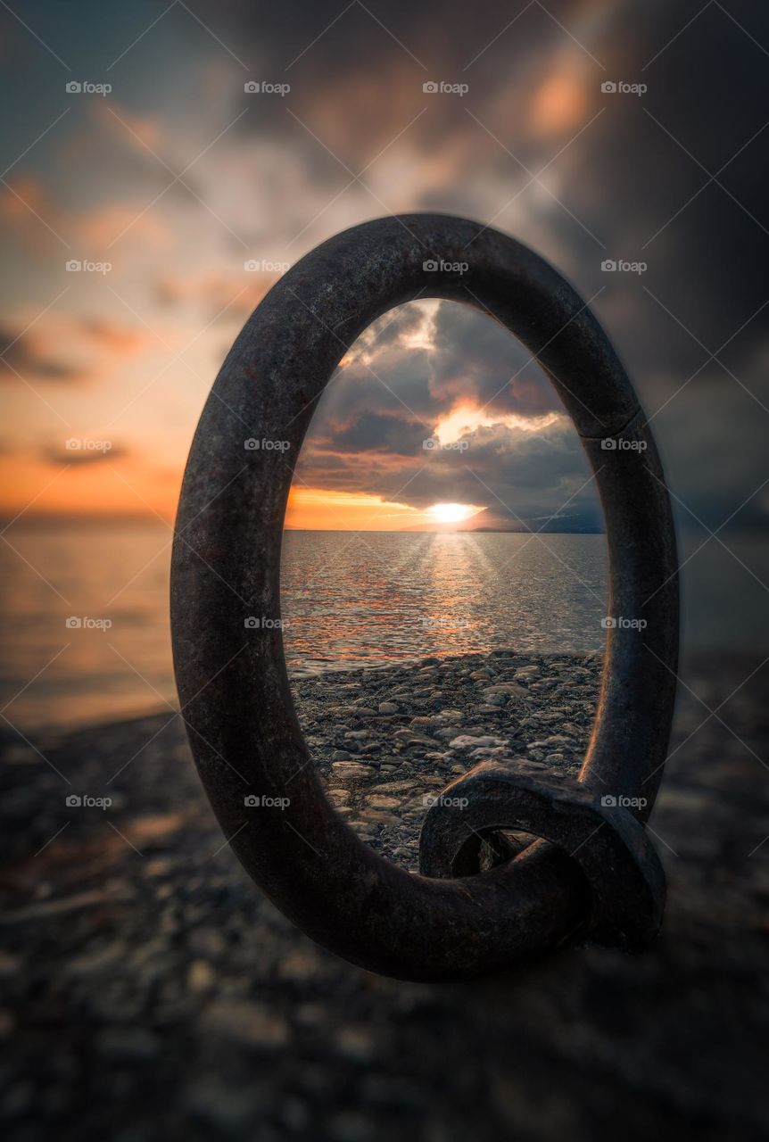 Sunset framed through a ring 