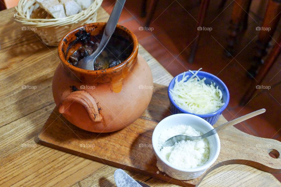 Boeuf bourguignon classic French beef on wood table with cheese