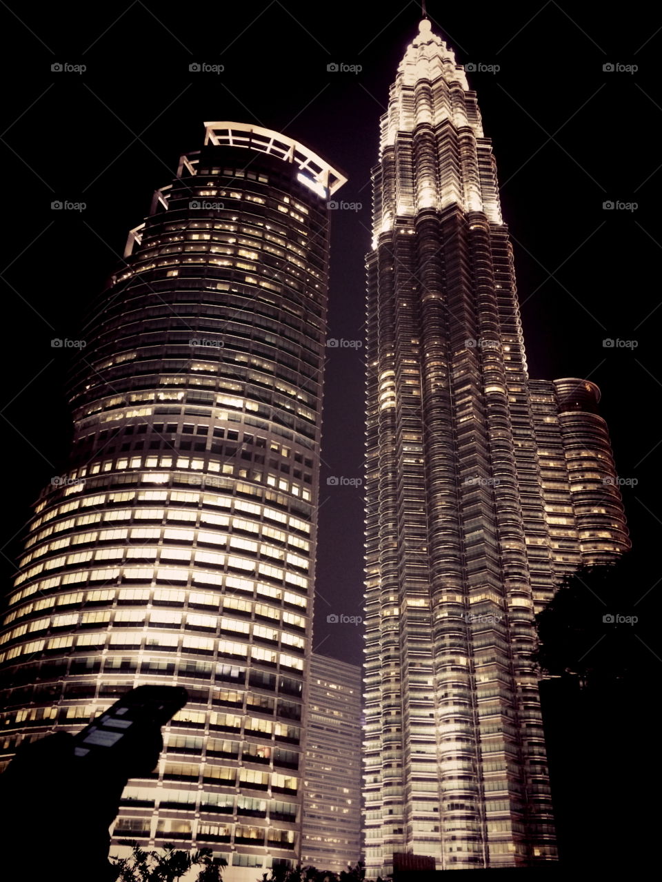 Vertically dramatism. Focusing on the highest building in KL from the rooftop of a mall. 