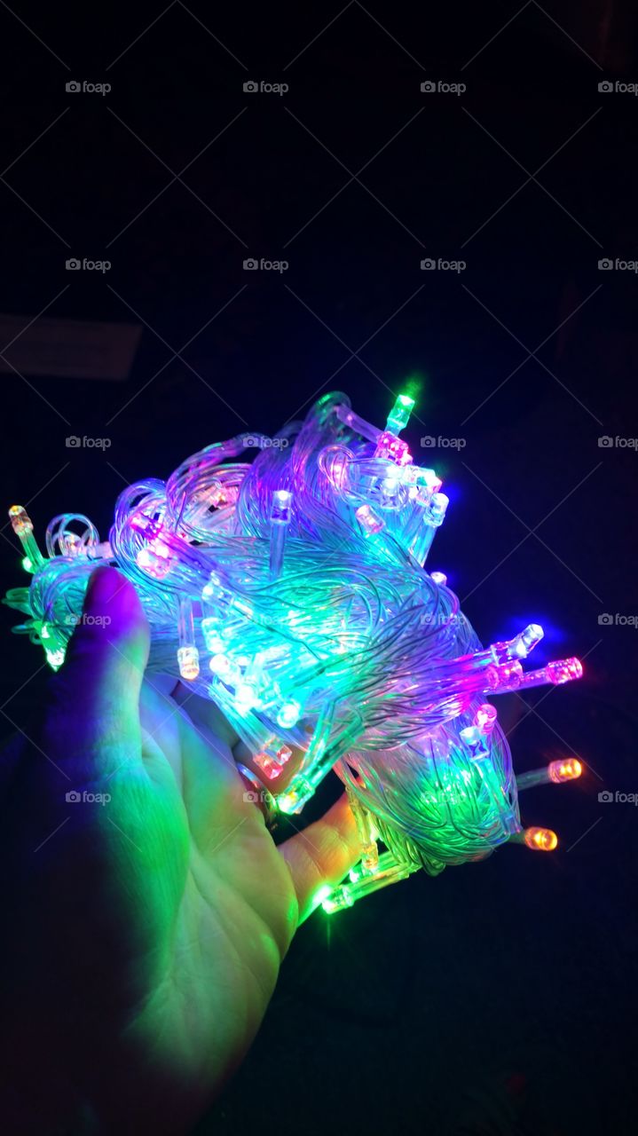 bright multicolor LED lights in hand