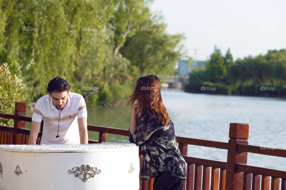 A couple was playing piano and I was passing by but I couldn't ignore this awesome scene so I captured it .