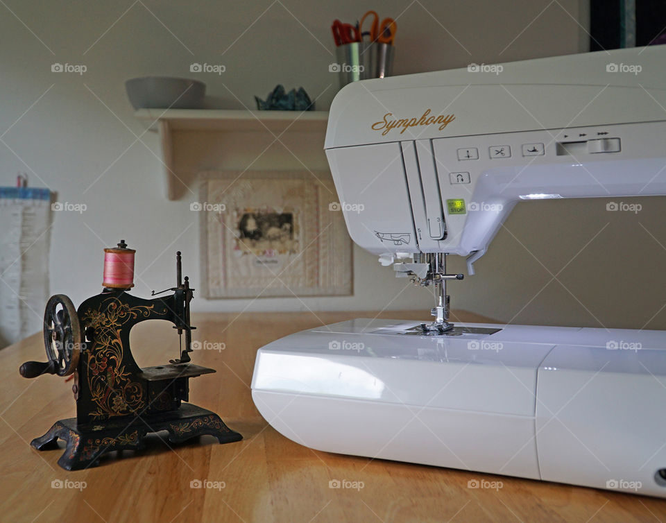 Antique sewing machine with contemporary machine 