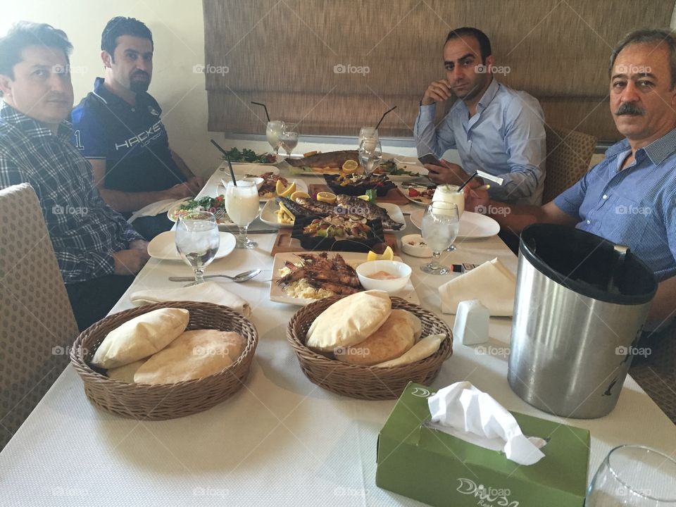 Group of indian man having lunch