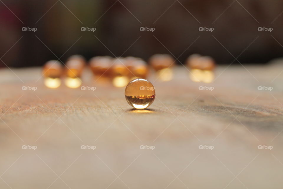 Pills, lights, ice, balls, hand, concrete, pills in hand, beautiful background, glass, round glass, glass balls, LEDs, capsules, bokeh, on the table, little rounds,