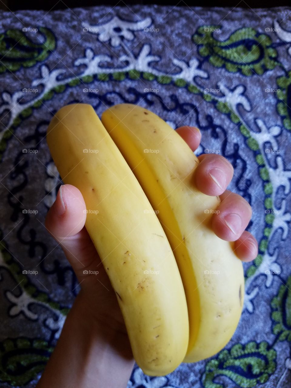 Holding bananas