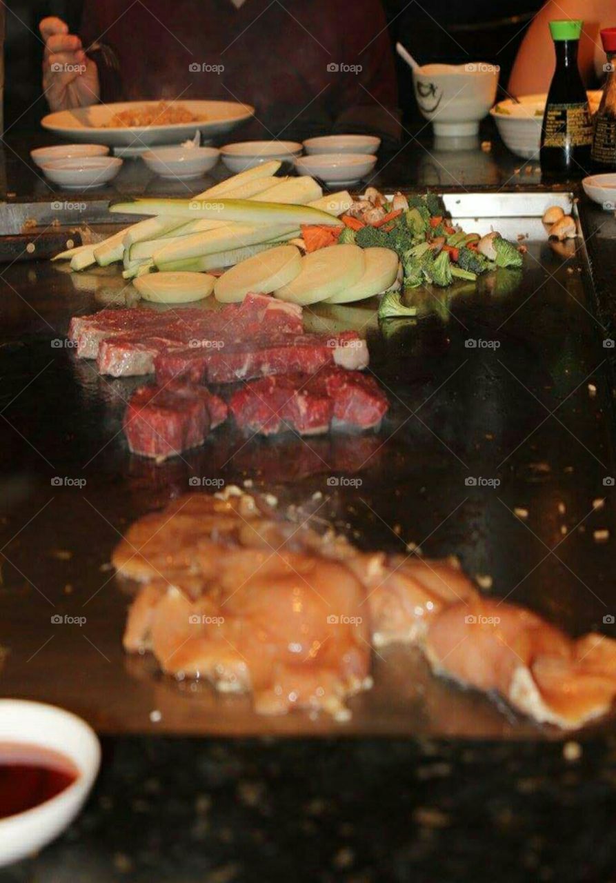 Cooking on a hibachi grill.