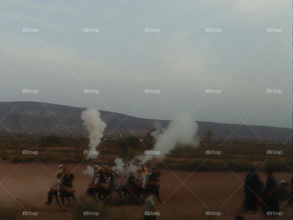 Moroccan fantasia by horses.